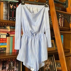 Blue boutique romper w/ tied ribbon fabric on side